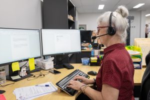 YOPS Staff member assisting client